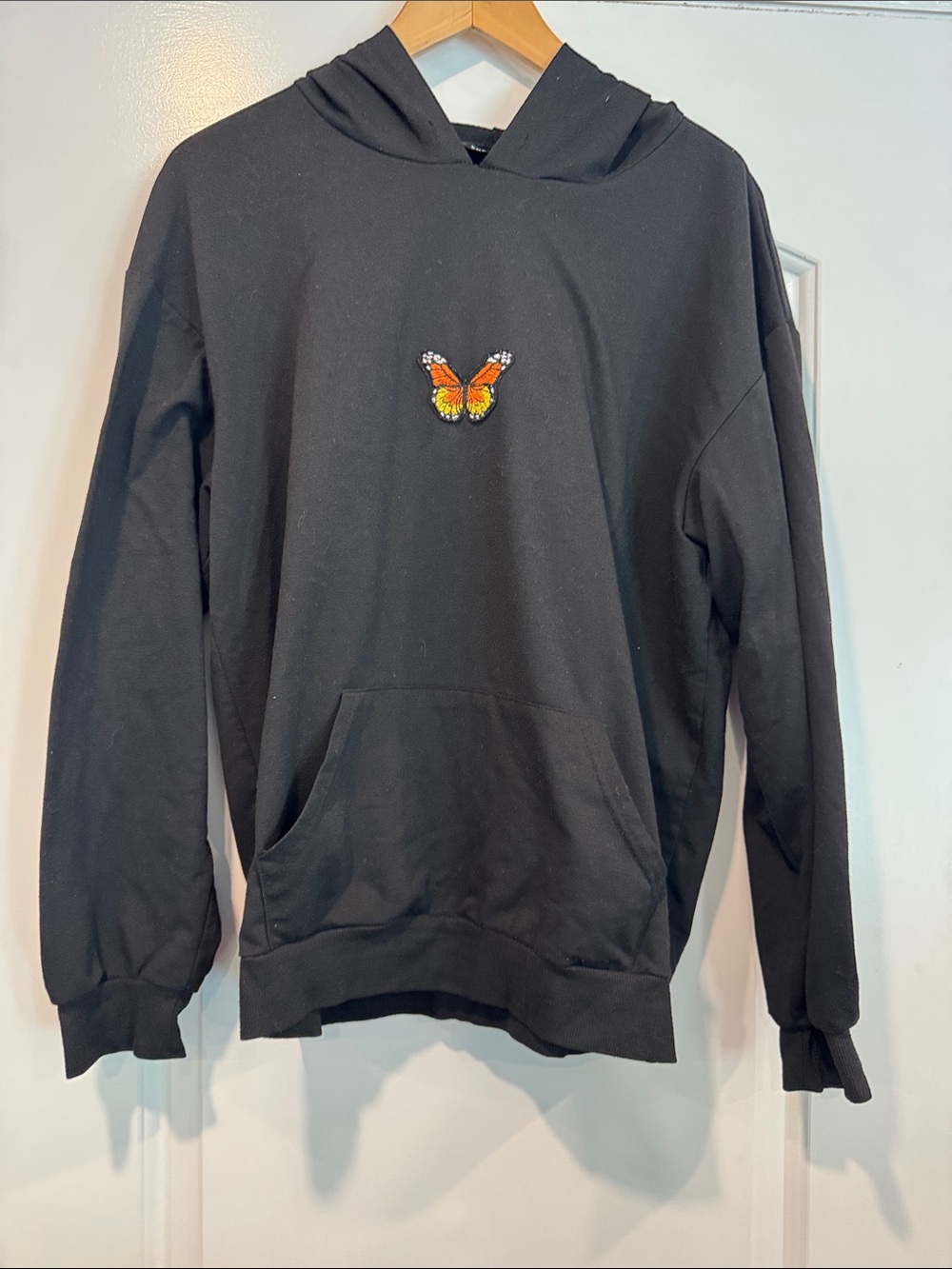 Black Hoodie with Orange Butterfly Patch Size 8/10 Women’s